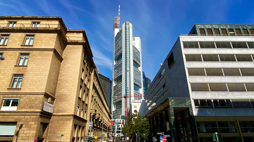 Low angle view of buildings against blue sky