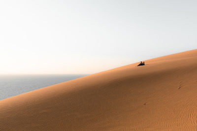 Scenic view of desert against clear sky