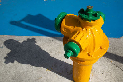 High angle view of fire hydrant on footpath