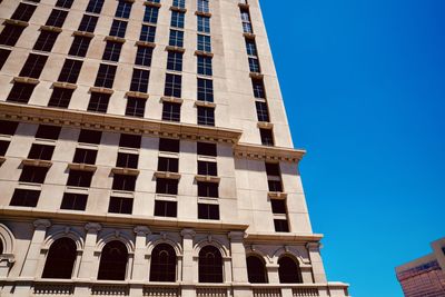 Low angle view of building against clear blue sky