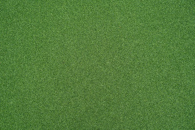 Artificial green grass for background. green grass turf floor texture background.