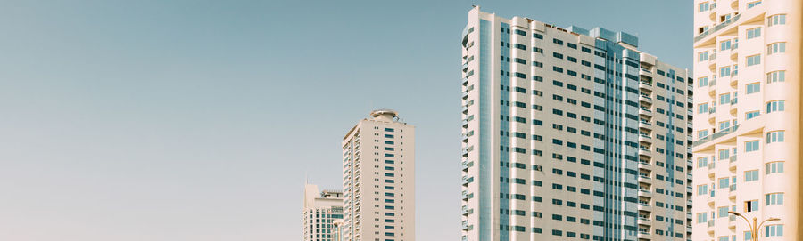 Low angle view of modern buildings against sky