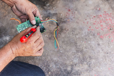 Technician is checking back side remote control motherboard.