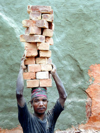 Close-up of a working man with brick