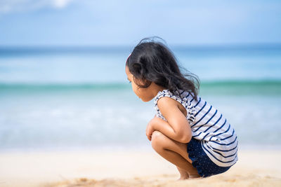 Side view of woman on beach