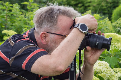 Portrait of man photographing