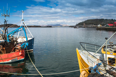 Boats moored in sea