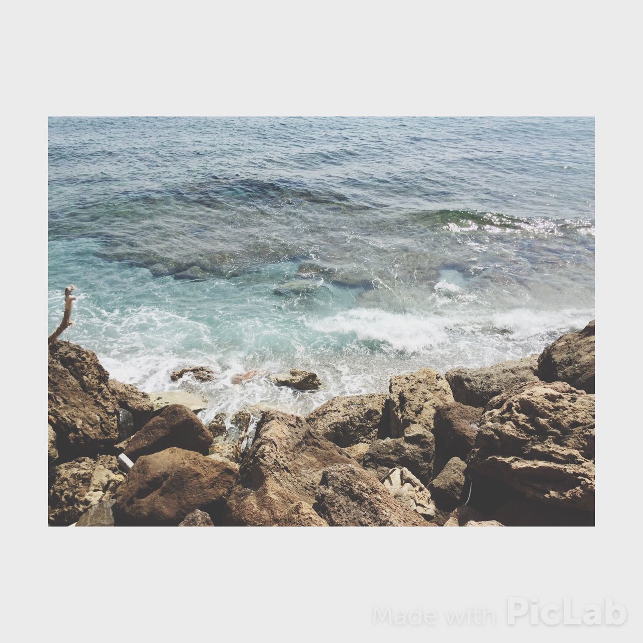 sea, water, horizon over water, transfer print, scenics, beauty in nature, auto post production filter, tranquility, tranquil scene, nature, wave, rock - object, beach, shore, surf, idyllic, clear sky, seascape, rock, rock formation