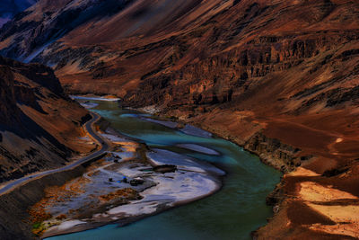 High angle view of river amidst mountains