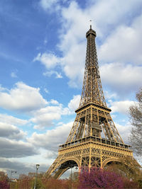Low angle view of communications tower against sky