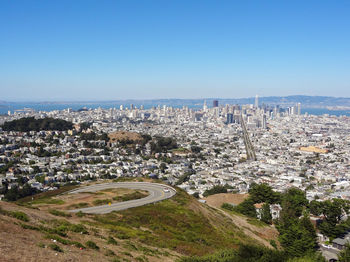 High angle view of townscape against clear blue sky