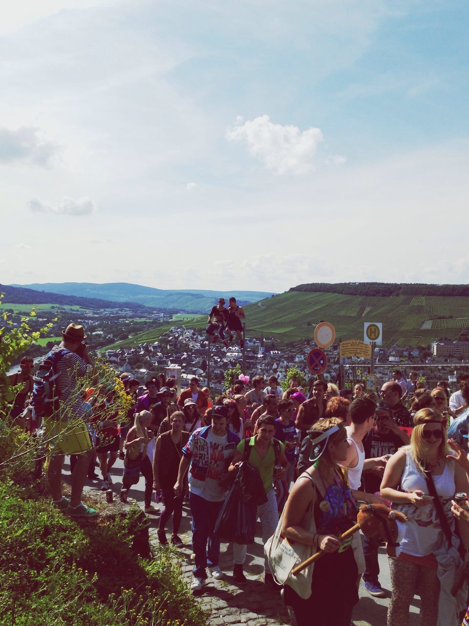 lifestyles, sky, leisure activity, large group of people, person, men, cloud - sky, togetherness, landscape, field, casual clothing, sitting, tree, nature, cloud, day, outdoors, crowd, high angle view