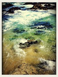 Waves splashing on rocks