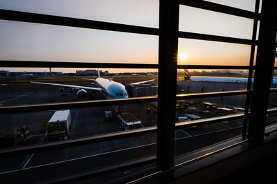 View of airport through airplane window