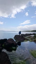 Scenic view of sea against cloudy sky