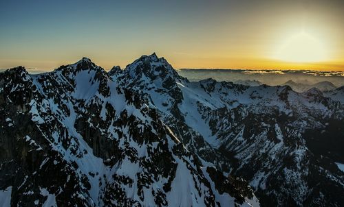 Scenic view of mountains against sky during sunset