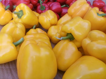 Full frame shot of yellow bell peppers for sale in market