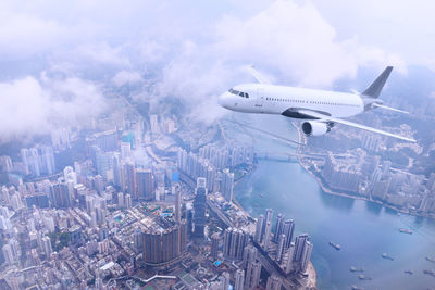 Aerial view of cityscape against sky