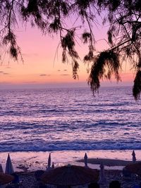 Scenic view of sea against orange sky