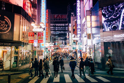 People in city at night