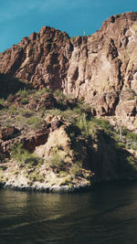 Scenic view of river and mountains against sky