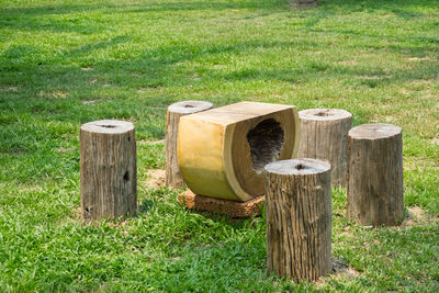 Wooden posts on field