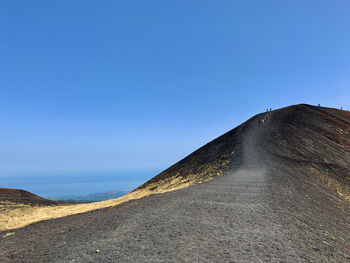 Black road of etna volcano in sicily