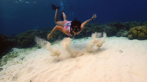 Woman swimming in sea