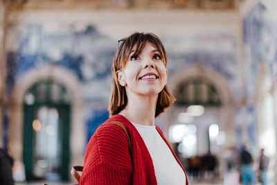 Low angle view of woman looking up