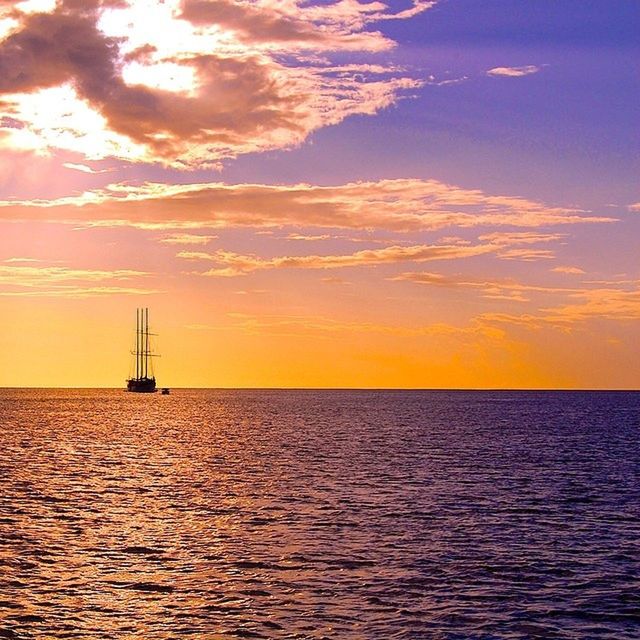 sea, sunset, water, horizon over water, waterfront, scenics, tranquil scene, tranquility, sky, beauty in nature, rippled, orange color, nature, idyllic, sun, silhouette, ocean, seascape, sailboat, cloud