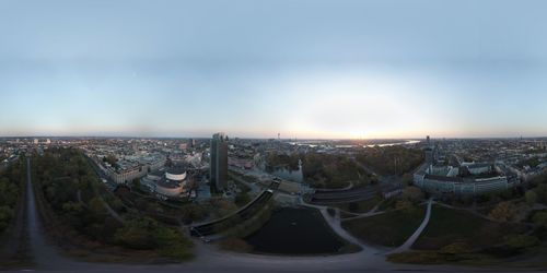 High angle view of buildings against cloudy sky