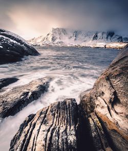 Scenic view of sea against sky during winter