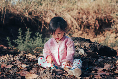 Girl sitting on field