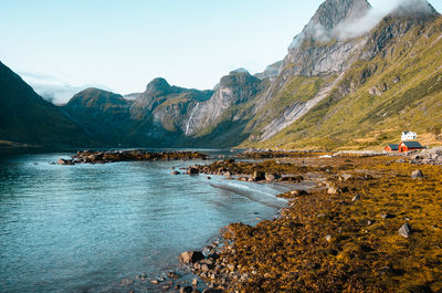 Scenic view of lake and mountains against sky