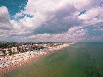 Panoramic view of sea and buildings against sky