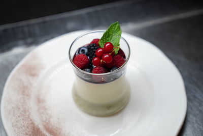 High angle view of strawberries in plate on table