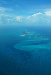 Scenic view of sea against blue sky