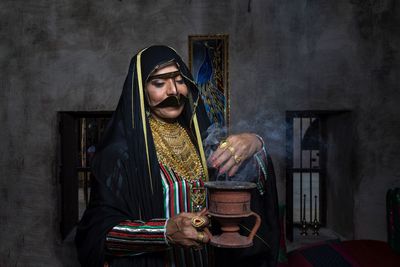 Woman wearing costume performing magic