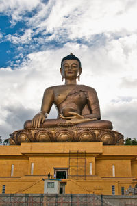 Low angle view of statue against sky