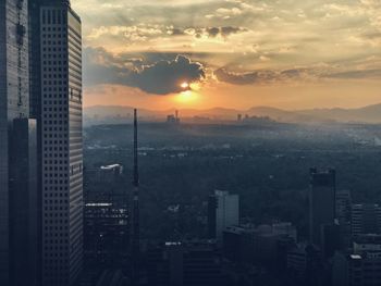 Cityscape against sky during sunset