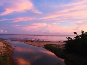 Scenic view of sea against sky at sunset