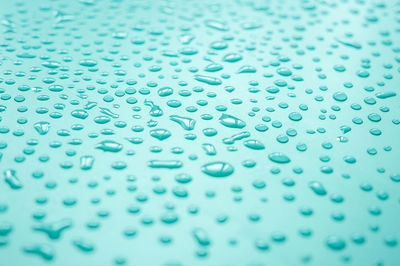 Full frame shot of water drops on metal