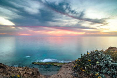Scenic view of sea against sky during sunset