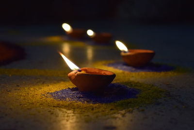 Diyas on floor at night