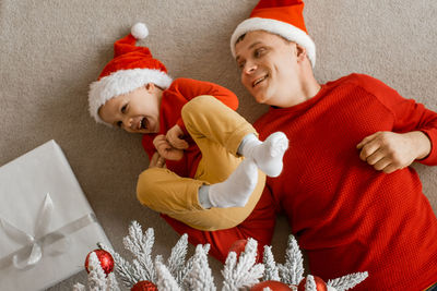 High angle view of cute baby girl with teddy bear