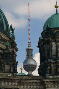 Low angle view of berlin cathedral and fernsehturm against sky