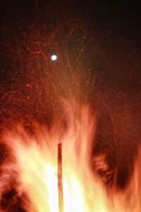Low angle view of fire crackers at night