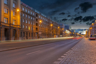 Illuminated city street at night