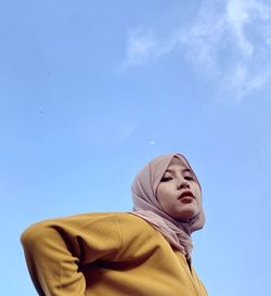 Malang, indonesia 22 june 2022 - low angle view of young girl against sky