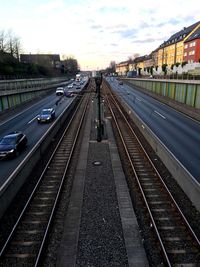 Train at railroad station against sky